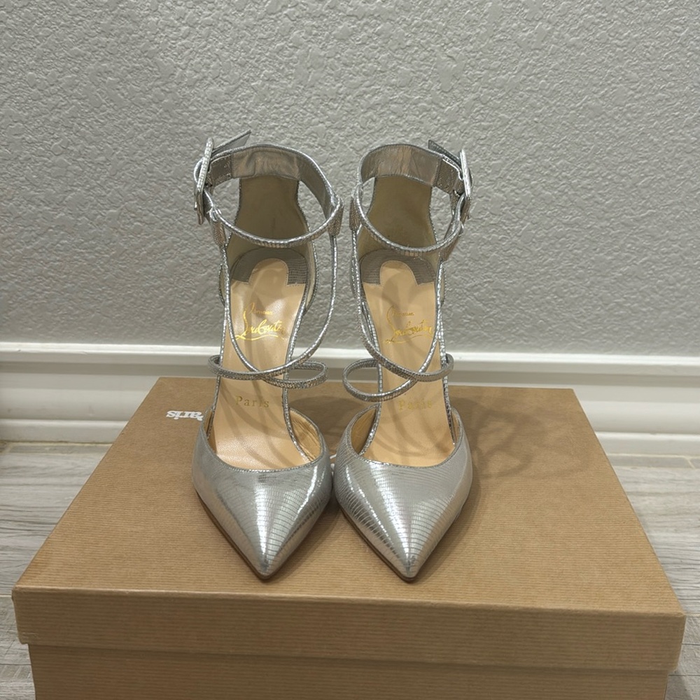 Striking in silver Christian Louboutins.